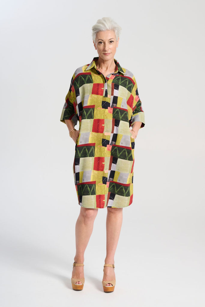 Olga de Polga shift shirt dress in green Sage Kismet print. Classic shift silhouette with a flattering collar and half sleeves.
Front button opening at neckline.
Slouchy batwing sleeves.
Finishes at the knee, depending on height. Front view on model.