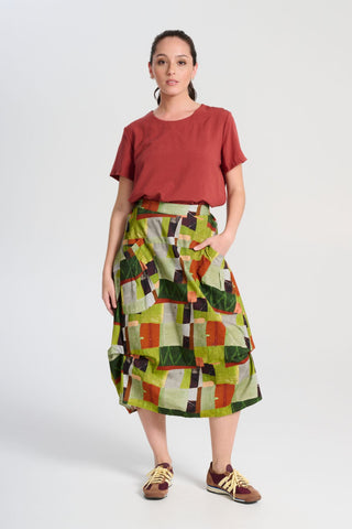 Olga de Polga Sage green Kismet printed Milwaukee skirt in fine cord. Large patch pockets. Unique panelled design. Back elasticated waistband. Front view on model.