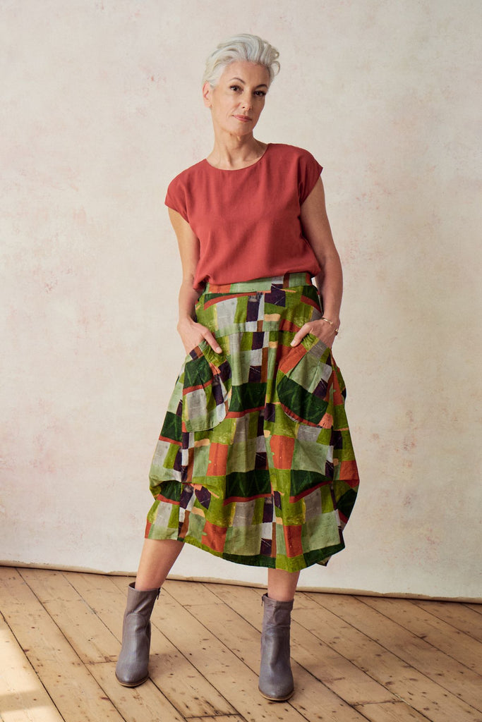 Olga de Polga Sage green Kismet printed Milwaukee skirt in fine cord. Large patch pockets. Unique panelled design. Back elasticated waistband.  Front view on model