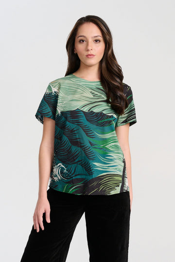 Olga de Polga Isla Top in green Tide printed cotton voile. With a round neckline and short sleeves, this is a boxy top great for women with a large bust. Front view on model.