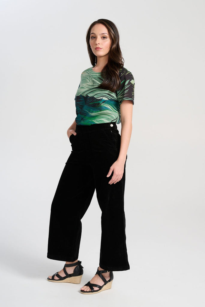 Olga de Polga Isla Top in green Tide printed cotton voile. With a round neckline and short sleeves, this is a boxy top great for women with a large bust. Side view on model.