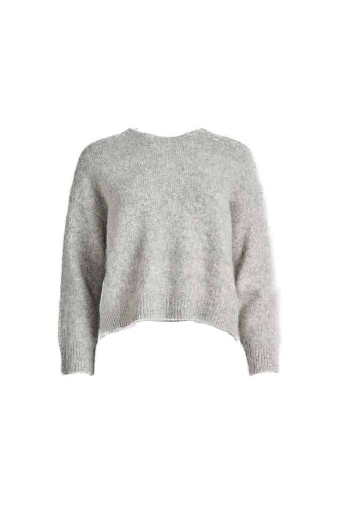 Olga de Polga Aspen sweater in Light Grey. With its soft alpaca blend, and insulating warmth, it’s the perfect staple for layering or wearing on its own. Front view