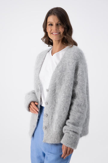 Olga de Polga Light Grey alpaca In Transit short cardigan with long sleeves. Side front view