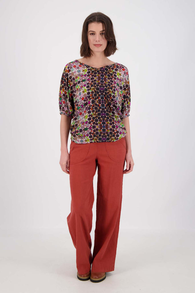 Olga de Polga Grey Kaleidoscope Camisa blouse in fine Tencel fabric. a reversible bat-winged blouse with short sleeves and is great for everyday wear. Front full length view on model 