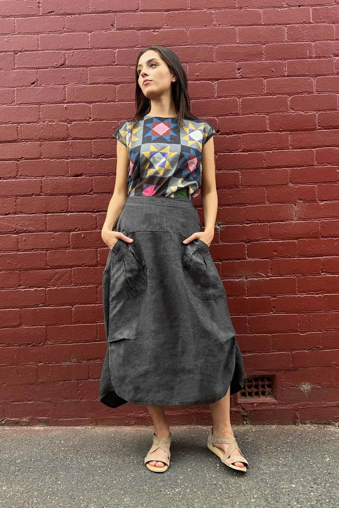 Olga de Polga Slate Milwaukee alta luxe linen skirt. Front view on model