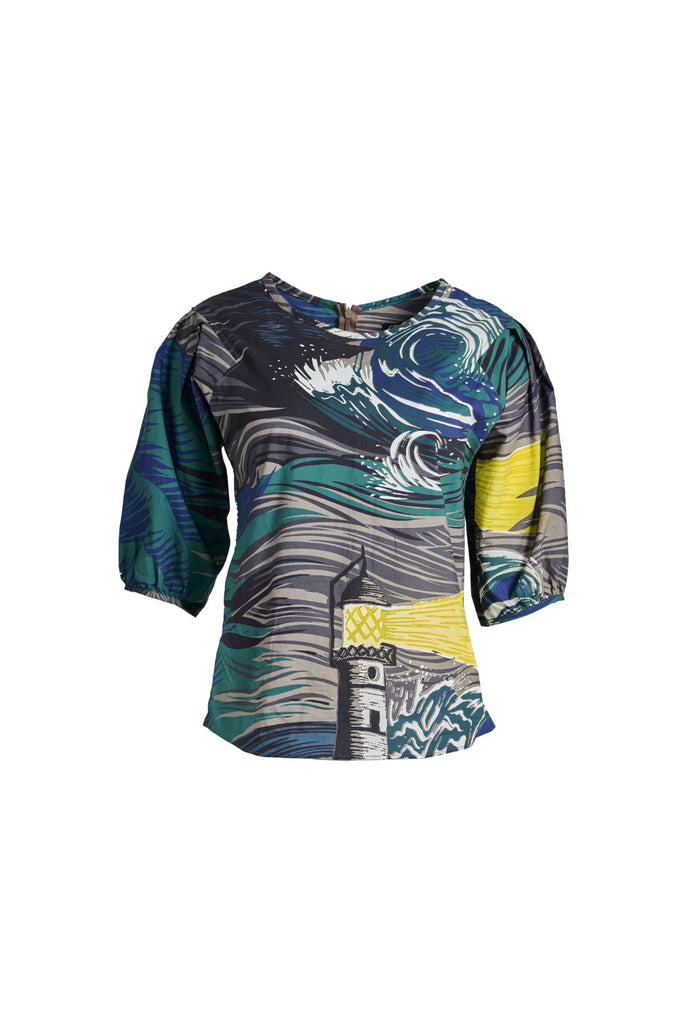 Olga de Polga classic blouse in the Storm Isla printed cotton. The blouse features a beautifully detailed lantern sleeve with a drop shoulder and delicate pleating on the shoulder and cuff. It also has a wide boat neckline and invisible zip fastening at the back. Front view