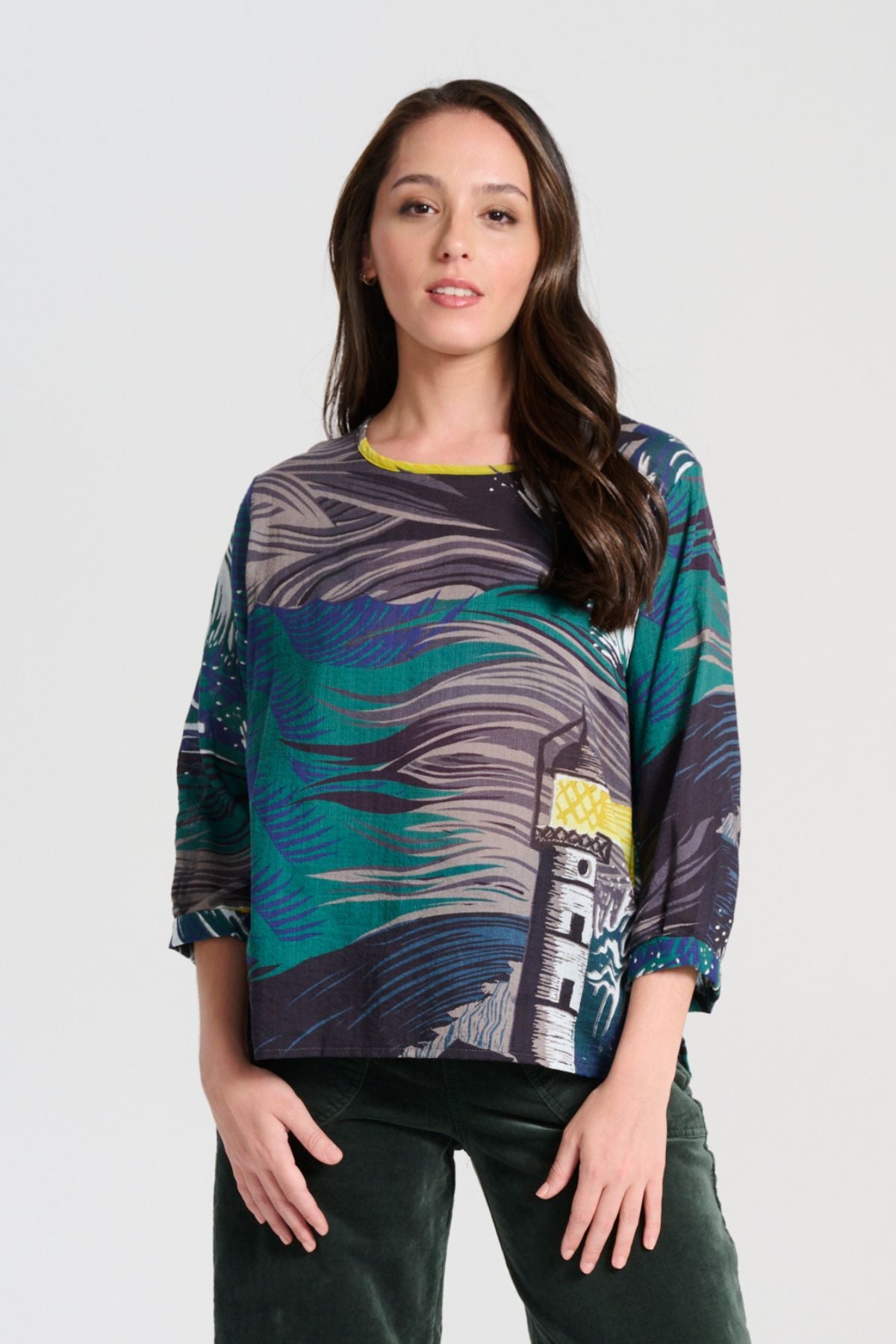 Olga de Polga Chemise blouse in the Isla Storm printed cotton from our Odyssey AW25 collection. this blouse features a flattering round neckline, a single button closure at the back, and a longer length than our signature blouse. The straight sleeves are finished with a simple cuff detail with a subtle box pleat. Front view on model.