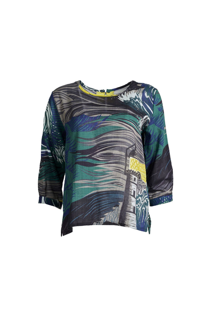 Olga de Polga Chemise blouse in the Isla Storm printed cotton from our Odyssey AW25 collection. this blouse features a flattering round neckline, a single button closure at the back, and a longer length than our signature blouse. The straight sleeves are finished with a simple cuff detail with a subtle box pleat. Front view