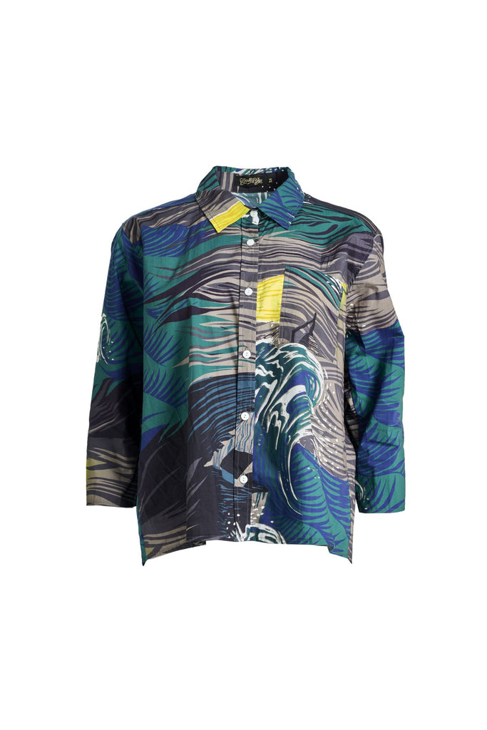Olga de Polga classic cotton shirt in the Storm grey and blue printed Isla print on 100% cotton. The front of the shirt sits at the waist while the back falls to the hips for a lovely drape.  Front view
