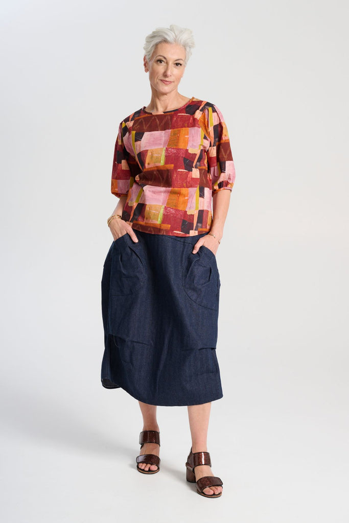 Olga de Polga Milwaukee Harper Skirt in Indigo Wash cotton denim. Comfy stretchy waistband and large front patch pockets. Front view on model.