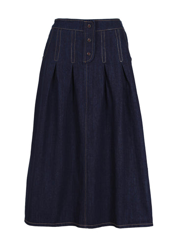 Olga de Polga Monde skirt in Indigo Wash denim. is a twist on an everyday denim skirt. Unique and super comfortable. Decorative button detailing at the front. Stitched down tucks coming down from waistband. Front view.