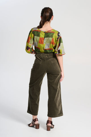 Olga de Polga Peggy Paris pants Olive in soft velvet. Comfortable high waist.
Elastic waistband at the back.
Stretchy wide leg.  Back view on model