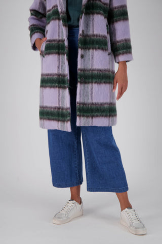 Olga de Polga Lilac Highland coat in wool and recycled polyester. Front hem view on model