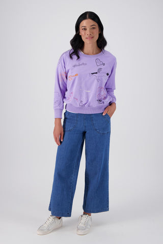 Olga de Polga Lilac Montage sweatshirt in a cotton tencel blend. Ribbing at the neck, cuffs and hem.  Front full length view on model
