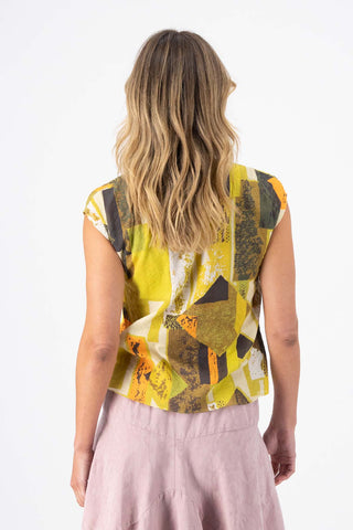 Olga de Polga Casco Tee in Lime green Splice printed cotton seersucker.  Round neckline. Cap sleeves, finished at the hip. Back view on model.