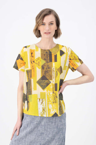 Olga de Polga Classic tee top in the Casco lime green Splice printed seersucker fabric. Round neck. Short sleeves, loose boxy fit. Front view on model.