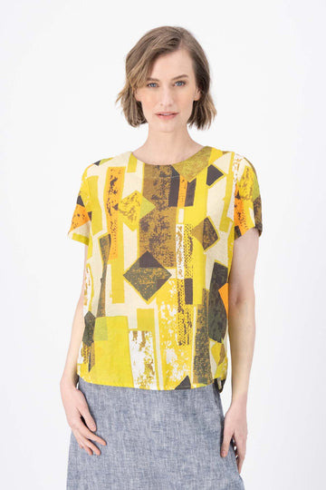 Olga de Polga Classic tee top in the Casco lime green Splice printed seersucker fabric. Round neck. Short sleeves, loose boxy fit. Front view on model.