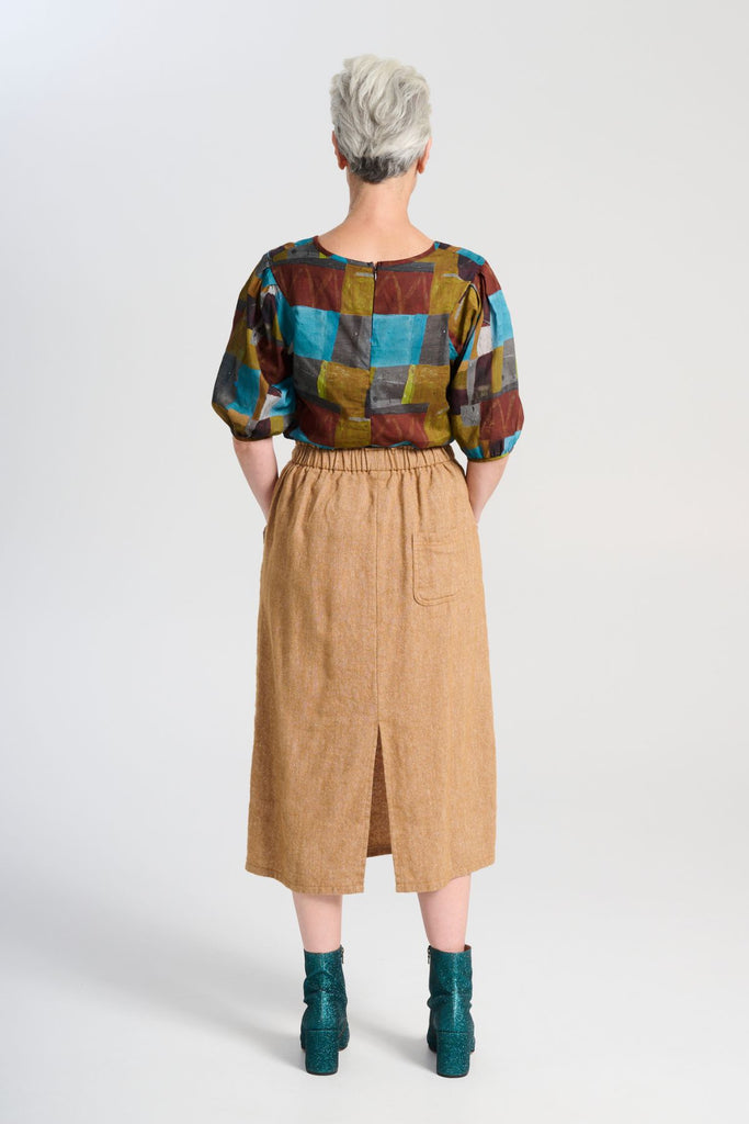 Olga de Polga Hepburn Haven skirt in Mustard wool/linen. Back view on model