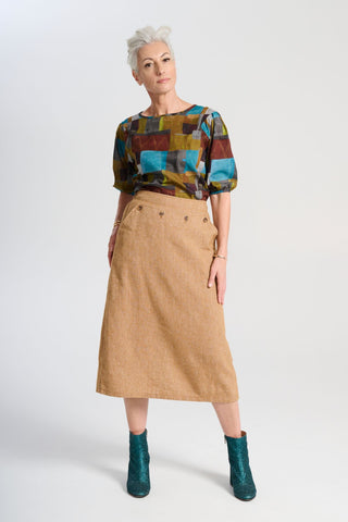 Olga de Polga Hepburn Haven skirt in Mustard wool/linen. Front view on model