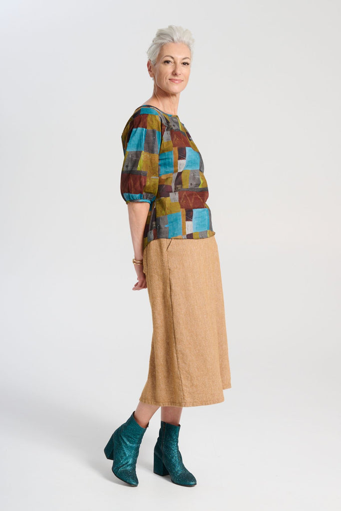 Olga de Polga Hepburn Haven skirt in Mustard wool/linen. Side view on model