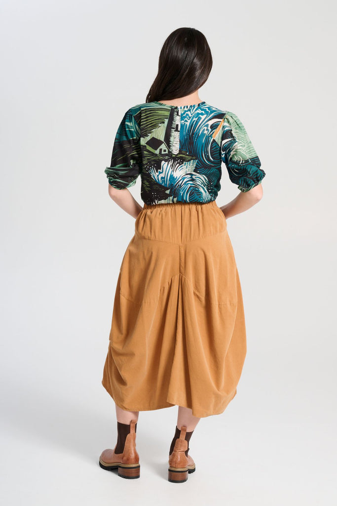 Olga de Polga Milwaukee Marlowe skirt in Mustard fine cotton cord. Comfy waistband making it the perfect throw-on-and-go!  Back view on model