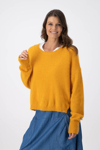 Olga de Polga Mustard Portland sweater in an angora/wool fabrication. With a round neck and slightly cropped length, the sweater has long sleeves.  Front view