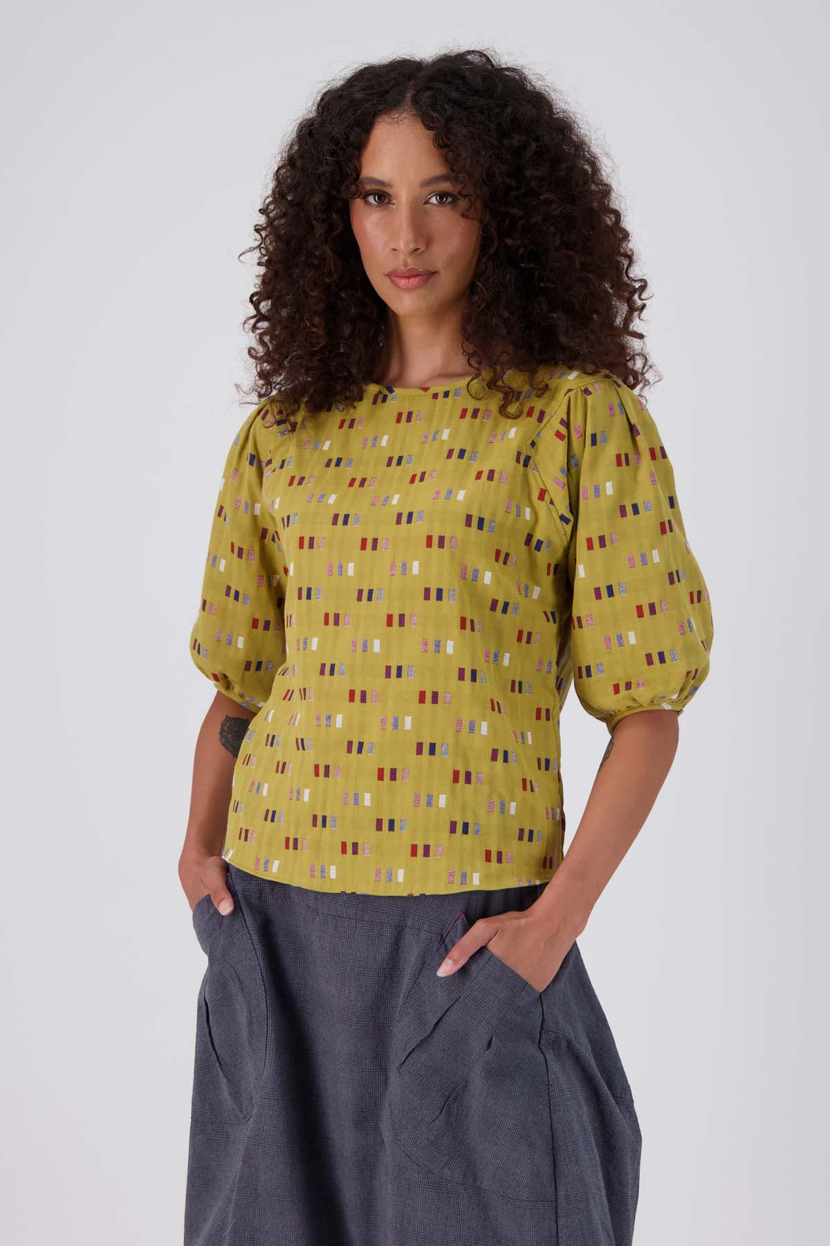 Olga de Polga Mustard Telegraph Blouse in woven cotton.  Front view on model