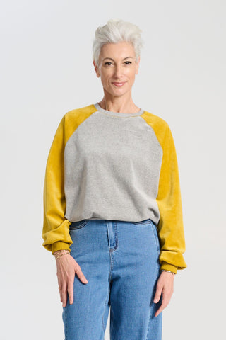 Olga de Polga Mustard and grey Odessa Sweatshirt in soft cotton velvet. Front view on model