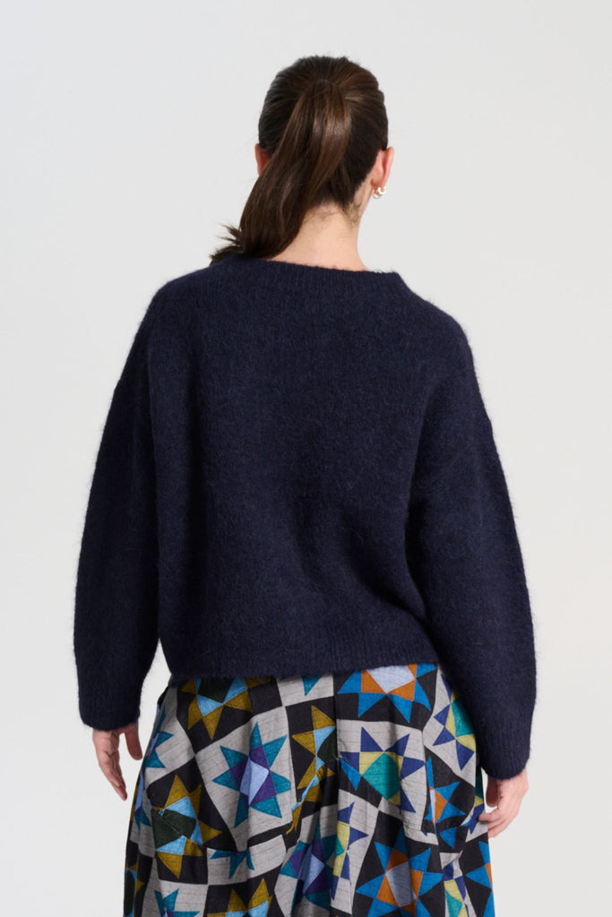 Olga de Polga Aspen knit sweater in Navy alpaca. Back view on model