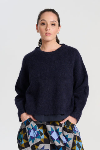 Olga de Polga Aspen knit sweater in Navy alpaca. Ribbing at neckline, wrists and hem. A beautifully textured knit sweater—your perfect winter essential for effortless, trans-seasonal styling.Front view on model