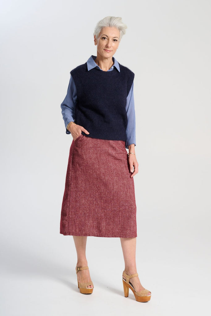 Olga de Polga Navy Aspen alpaca knit vest. Ribbing at neckline and hem. A beautifully textured knit vest—your perfect layering essential for effortless, trans-seasonal styling. Front full view on model