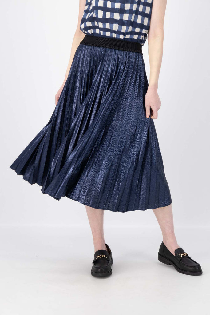 Olga de Polga Navy Champagne pleated skirt in 100% recycled polyester. Front close-up view on model.