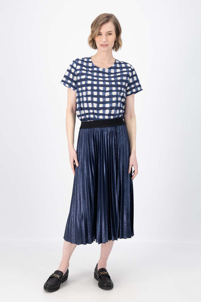 Olga de Polga Navy Champagne pleated skirt in 100% recycled polyester. Front view on model.