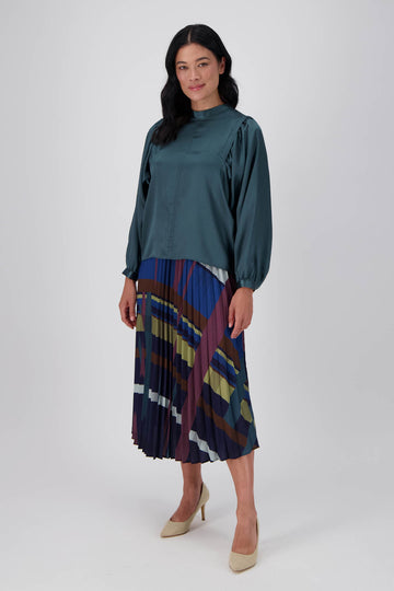 Olga de Polga pleated skirt in our Crossroads Woodlands printed recycled polyester. elasticated waistband. Midi length. Front full length view on model