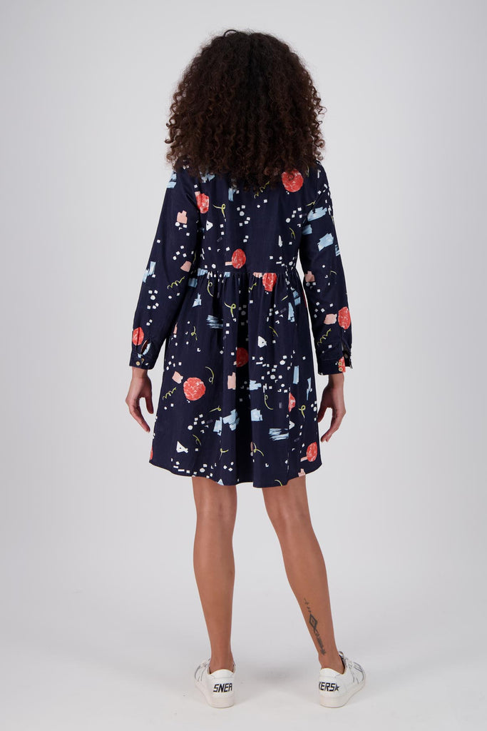 Olga de Polga navy Galaxy printed cotton cord tunic dress. Perfect transeasonal dress with long sleeves and a round neckline. Back full length view