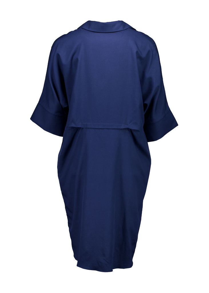 Olga de Polga Marianna Estilo dress in Navy. Shirt dress with bat-wing sleeves and a collar with short button opening at the front. Finishes above the kneed depending on height. Back view.