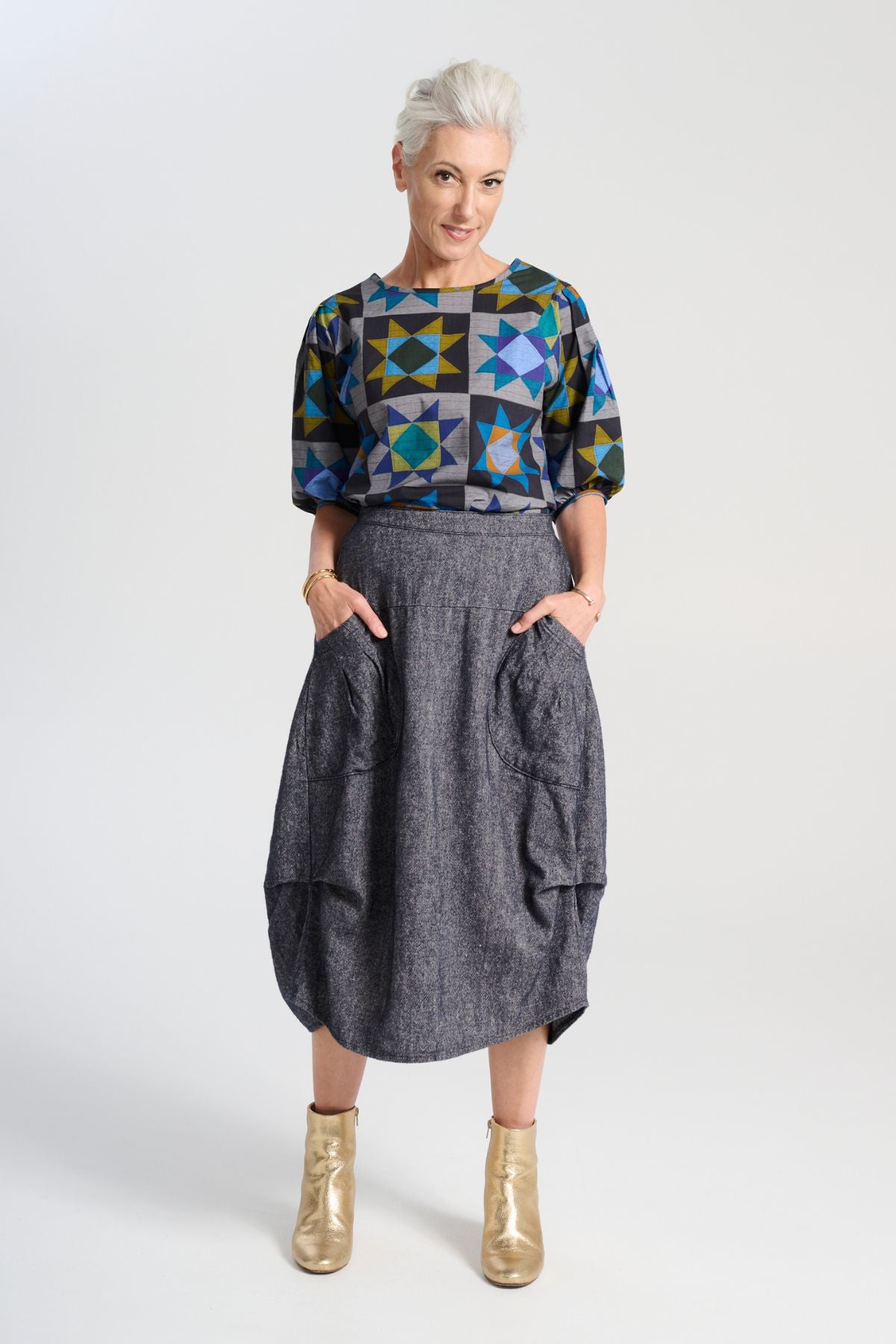 Olga de Polga Navy Milwaukee skirt in Haven wool/linen. Our Milwaukee Haven Skirt in the Navy wool/linen blend is an incredibly unique, chic and original skirt. It is universally flattering, highly versatile, and super comfortable. Front view on model