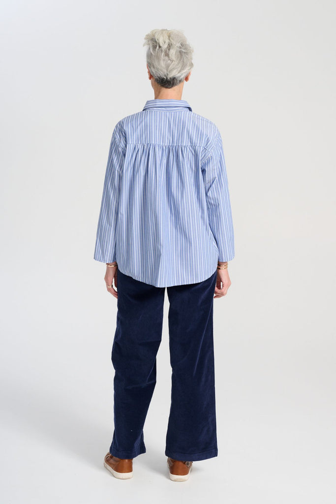 Olga de Polga Peggy Paris Pants Long in Navy soft velvet. Full length, wide leg pants with a back elasticated waistband. Back view on model.