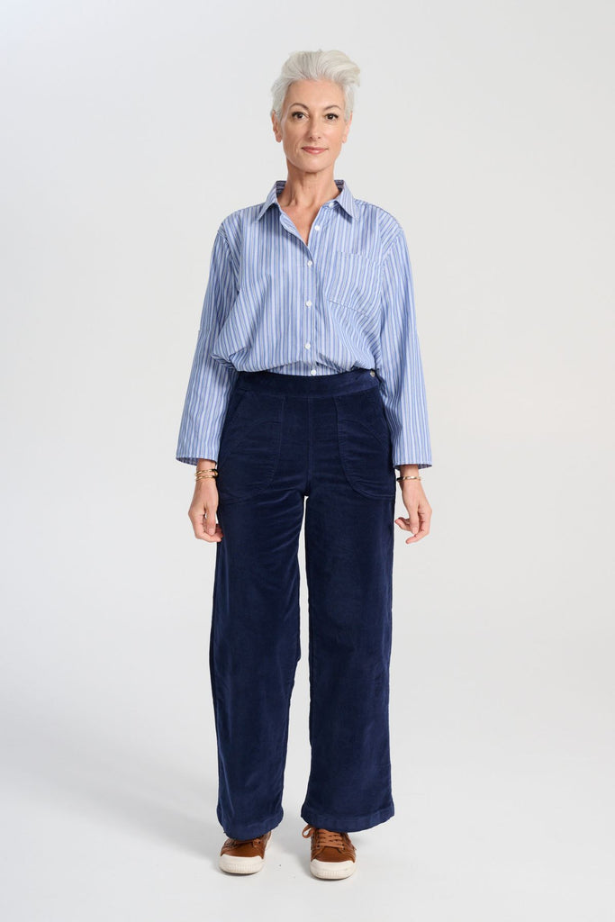 Olga de Polga Peggy Paris Pants Long in Navy soft velvet. Full length, wide leg pants with a back elasticated waistband. Front full length view on model.