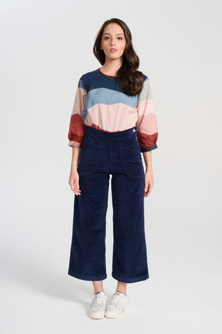 Olga  de Polga Peggy Pants Navy in soft velvet for the AW25 Odyssey collection. Cropped, wide leg. Large patch pockets. Front full length view on model.