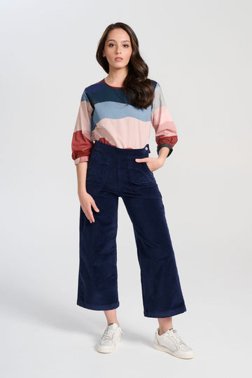 Olga  de Polga Peggy Pants Navy in soft velvet for the AW25 Odyssey collection. Cropped, wide leg. Large patch pockets. Front view on model.