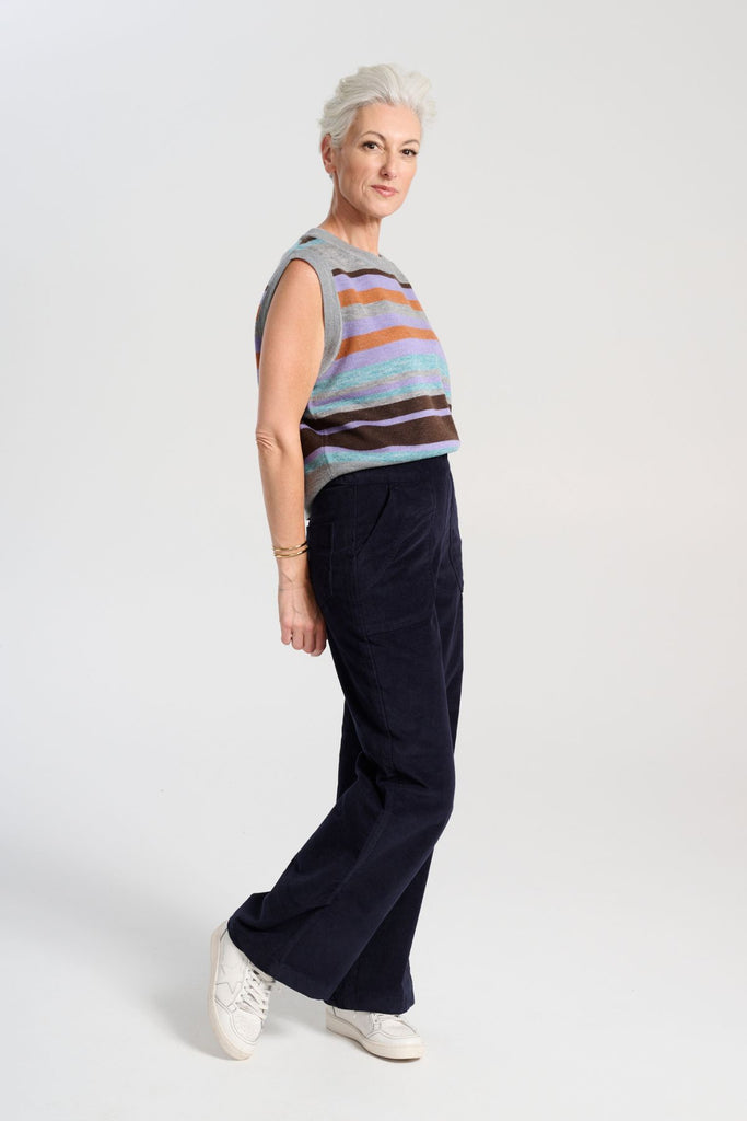 Olga de Polga Navy Peggy Sue Long velvet cotton cord pants. Wide leg. Large patch pockets. Full length. Side view on model