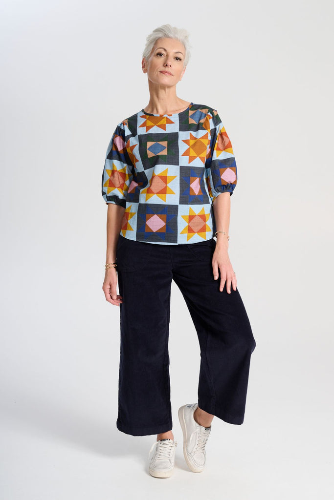 Olga de Polga Peggy Sue Pants cropped, in navy cotton velvet corduroy. Wide legged. Large patch pockets. Front full length view on model