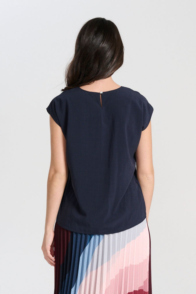 Olga de Polga Navy tencel Rhea tee. With a round neckline and cap sleeves this tee is perfect for all occasions. Button fastening at back neck. Back view
