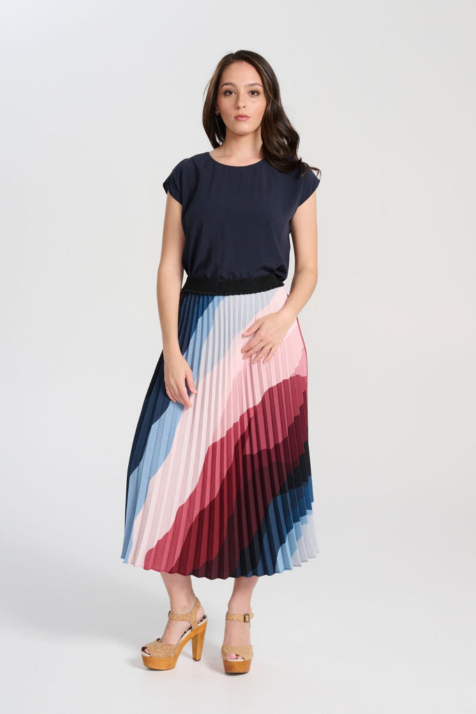 Olga de Polga Navy tencel Rhea tee. With a round neckline and cap sleeves this tee is perfect for all occasions. Button fastening at back neck. Front full view on model, tucked in.