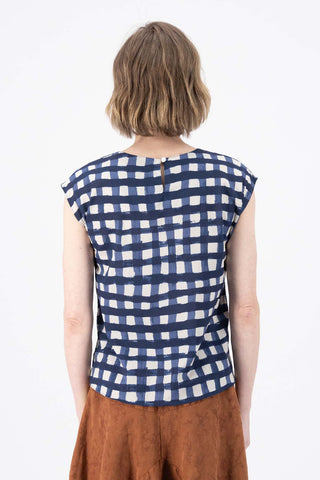 Olga de Polga classic cotton tee in Navy Rosa print. Crew neck and cap sleeves. Back neck opening. Back view on model.