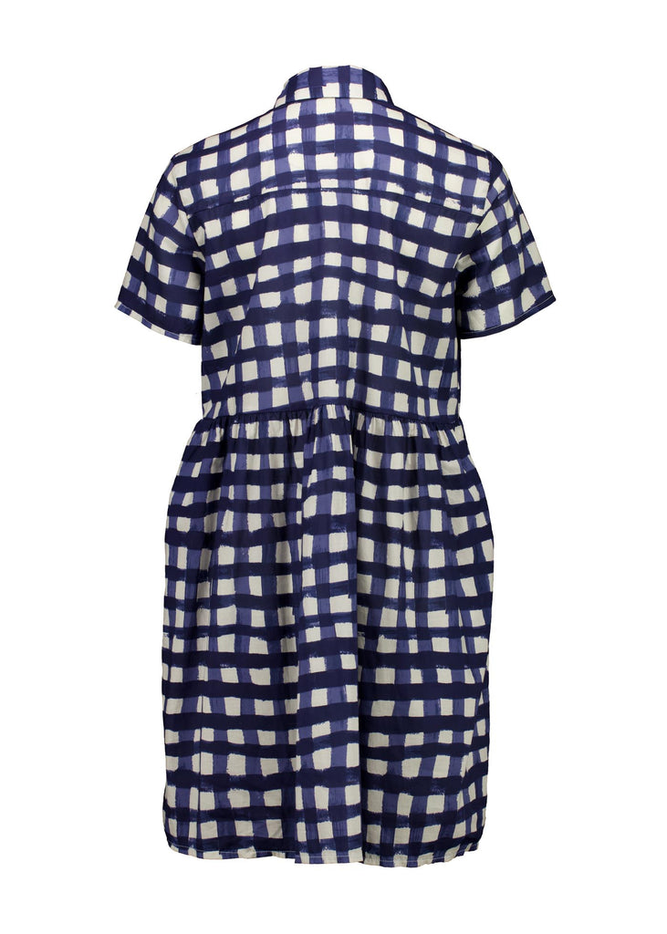 Olga de Polga's Villa drop waist dress in Rosa Navy printed 100% cotton fabric. Short sleeves, button front, collar, finishes at the knee, depending on height. Back full length view.