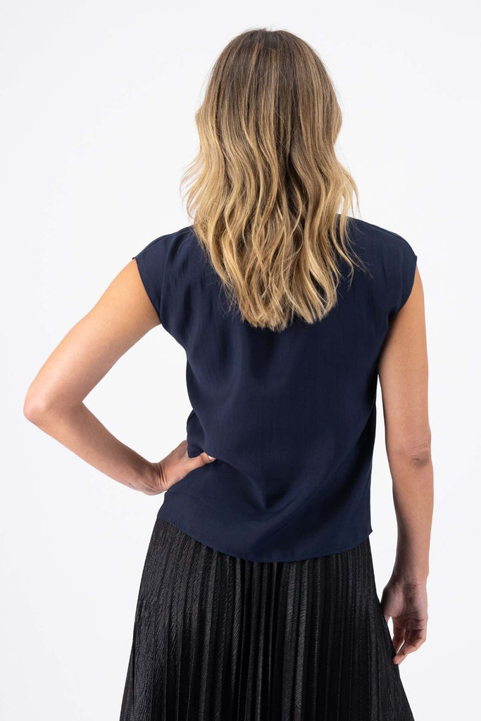 Olga de Polga classic tee in Navy Skyscraper tencel. Round neck with cap sleeves. Back view on model.