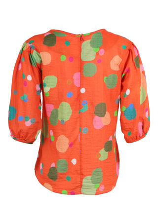 Olga de Polga classic blouse in our Orange Astra printed cotton seersucker fabric. Wth a round neckline and half sleeves, this blouse finishes at the hip. Back view
