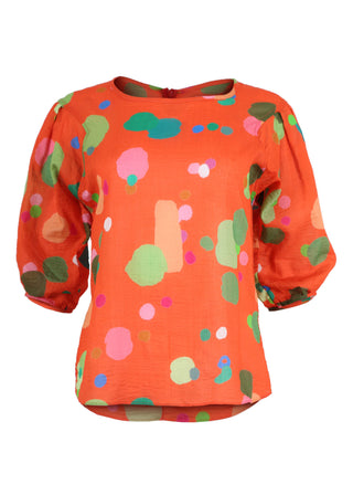 Olga de Polga classic blouse in our Orange Astra printed cotton seersucker fabric. Wth a round neckline and half sleeves, this blouse finishes at the hip. Front view.